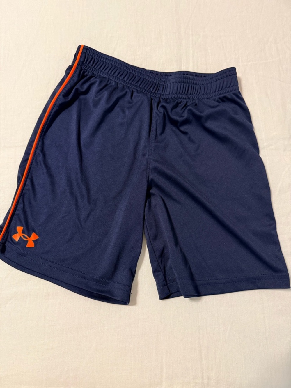 Under Armour Navy blue Athletic Shorts with Orange Accents for boys size 7